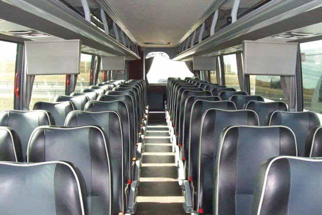 Interior view of Windstar bus seats and tv monitors