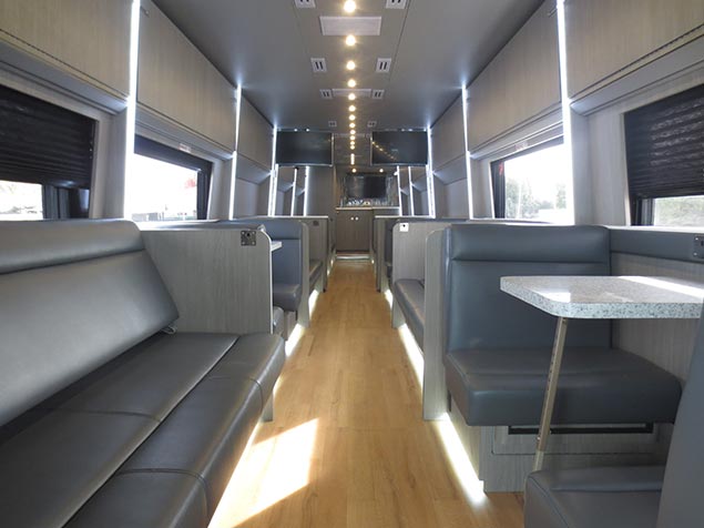 Interior of a Windstar Bus with tables and couches