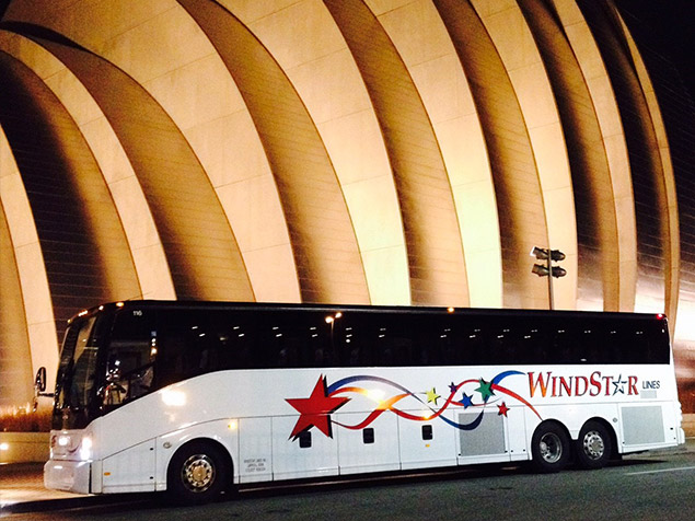 Windstar buses parked next to Crown Center at night