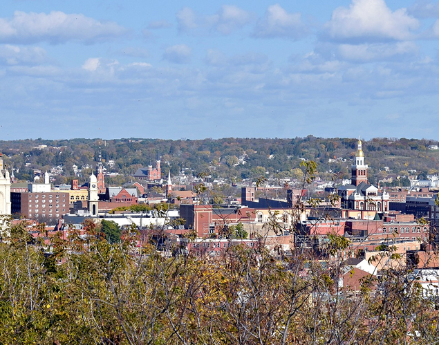 Dubuque, IA city skyline with trees in bottom of frame