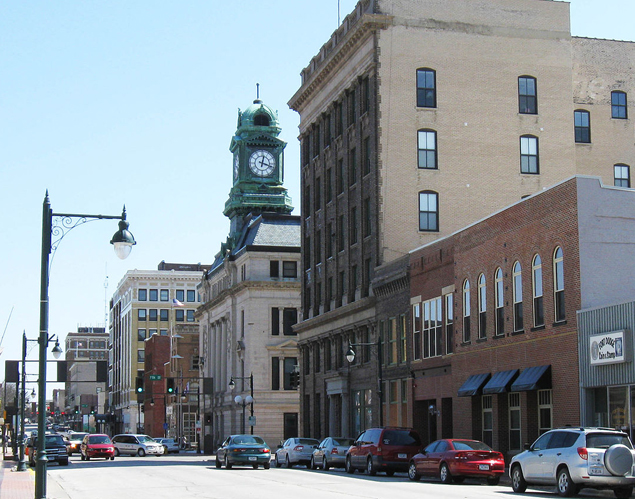 View of Downtown Fort Dodge, IA storefronts and clock