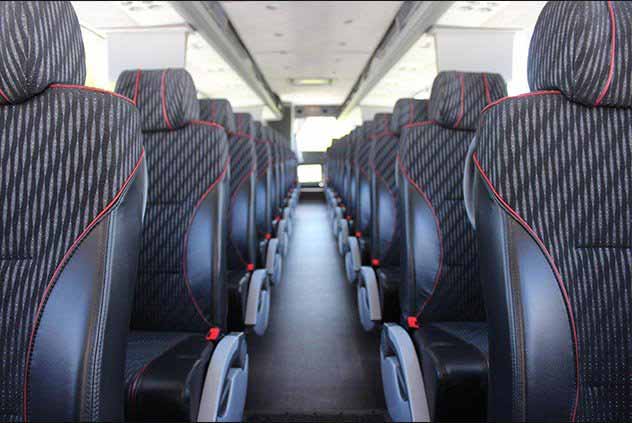 Leather and cloth seats inside a Windstar charter bus